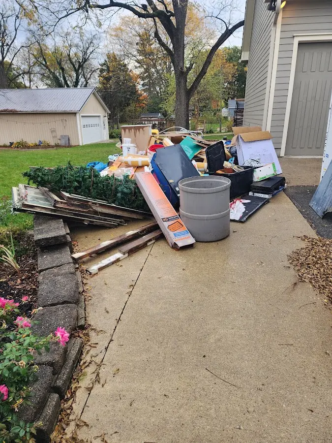 Dumpster being loaded with debris for Estate Cleanout Dumpster Rental in East Petersburg